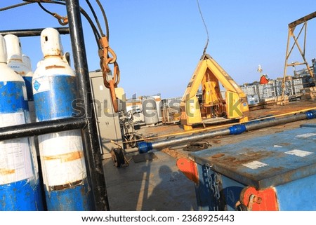 Tools for transferring personnel or toad baskets are prepared to move oil and gas workers from the platform to crew members operating in offshore areas.