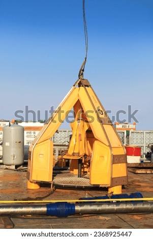 Tools for transferring personnel or toad baskets are prepared to move oil and gas workers from the platform to crew members operating in offshore areas.