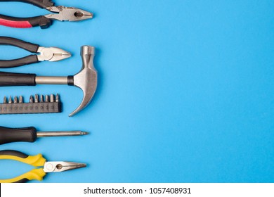 Tools Worker, Hammer, Screwdriver, Pliers On A Blue Background, Top View