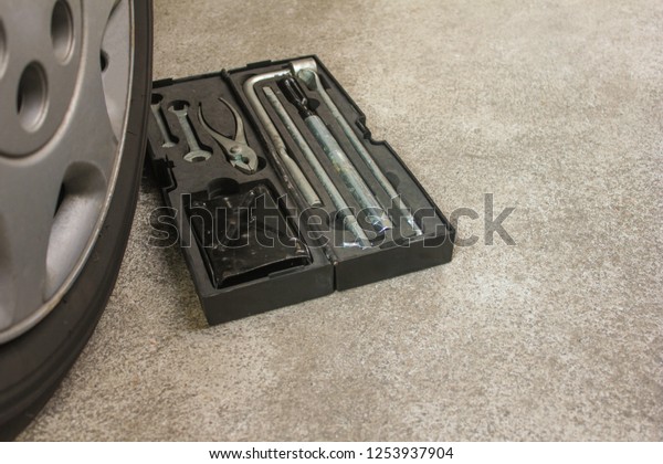 Tools\
wrench for car repair in the box with old car\
wheel