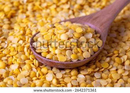 Toor dal or split yellow lentils isolated. Split Chickpea in a Bag Also Know as Chana Dal, Yellow Chana Split Peas, Dried Chickpea Lentils 