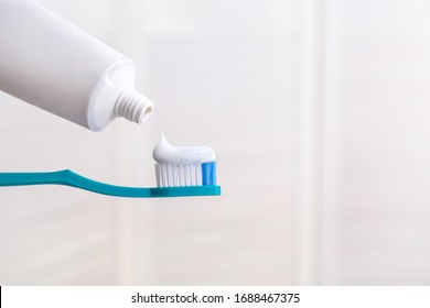 Tooth Brush With Paste In Bathroom