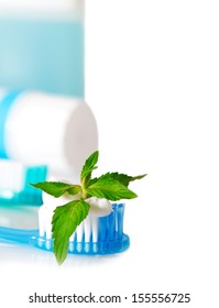 Tooth Brushes With Mint, Tooth Paste And Dental Floss Isolated On White. Stomatology Equipment And Dental Care