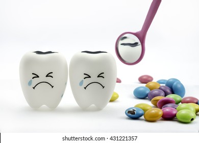 Tooth Decay Is Crying With Dental Mirror And Sugar Coated Chocolate On The Side. On A White Background