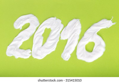 Tooth Paste In The Form Of Numbers 2016  On The Green Paper Background. Christmas Theme.