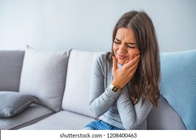 Toothache, Beautiful Woman with Tooth Infection. Young Woman Suffering From Toothache . Close up of pretty disappointed woman which having toothache
