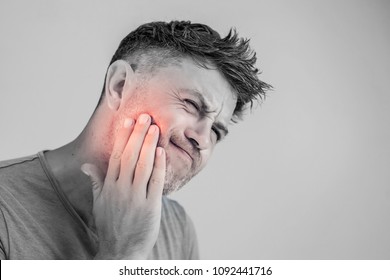 Toothache, medicine, health care concept, Teeth Problem, young man suffering from tooth pain, caries