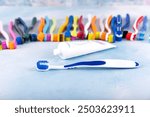 Toothbrush and dental floss. Set of colorful toothbrushes with toothbrush, dental floss on a blue background.