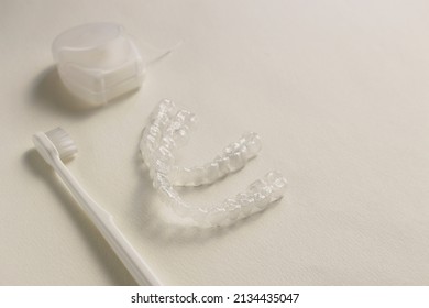 Toothbrush, Mouthpiece and dental floss on a white background