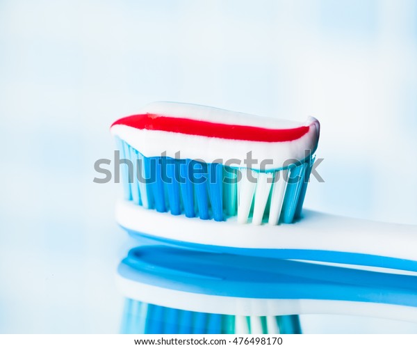 red white and blue striped toothpaste