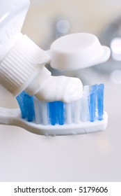 toothbrush and toothpaste close-up