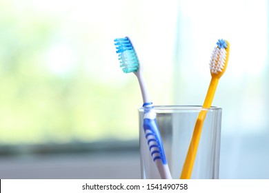Toothbrushes and oral cleaners on the table.
