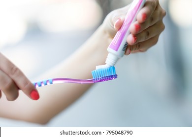 toothpaste on toothbrush