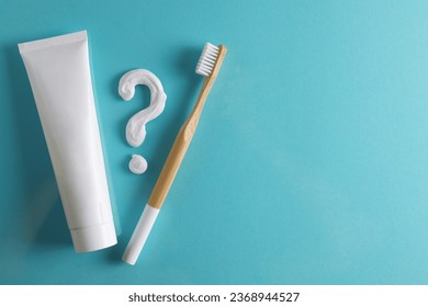 Toothpaste question mark on a colored background. Dental care, oral health.