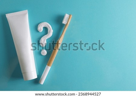 Toothpaste question mark on a colored background. Dental care, oral health.