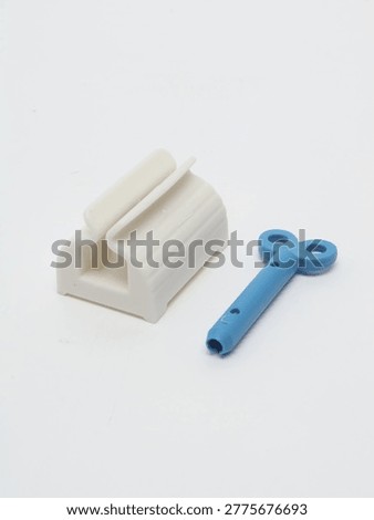 Toothpaste Squeezer on a gray background