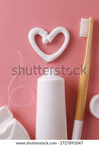 Toothpaste and toothbrush on a colored background. Dental care, oral health. Vertical photo format	