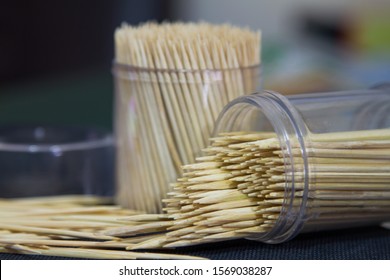 Toothpick box With a plastic cover With a toothpick arranged in the table On an black background, isolated