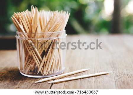 Toothpicks on wooden table for background , (close up)