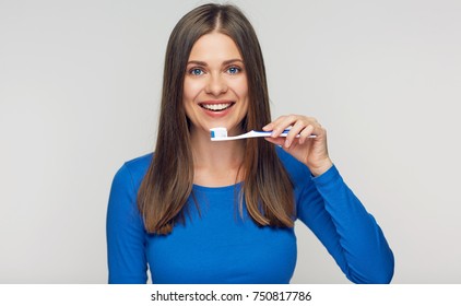 Toothy Brush Woman Holding On White Background. Smiling Girl Teeth Health Concept.