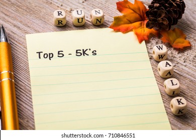 Top 5 - 5K run walk concept on notebook and wooden board