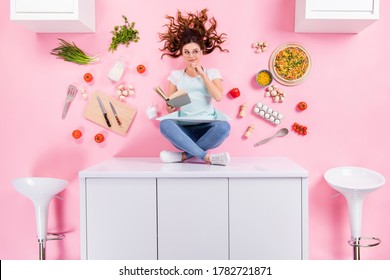 Top above high angle view full size photo minded housewife girl sit table read book think decide menu pizza recipe cook supper flat lay tomato eggs utensils isolated pastel color background