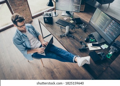 Top above high angle view of his he nice attractive focused skilled guy geek typing coding web development remote support security safety at modern loft industrial home office work place station - Shutterstock ID 1825159640