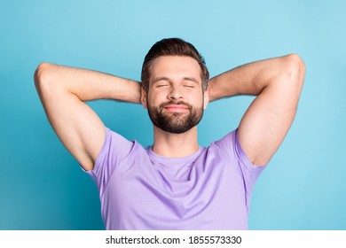 Top above high angle view photo of young attractive man enjoy free time rest relax hands behind head isolated over blue color background