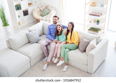 Top Above High Angle View Full Body Photo Of Cheerful Family Happy Positive Smile Sit Sofa Indoors Laugh Watch Movie