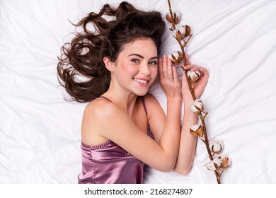 Top Above High Angle View Portrait Of Attractive Cheery Gentle Sweet Girl Lying On Cozy White Linen Holding Fresh Branch