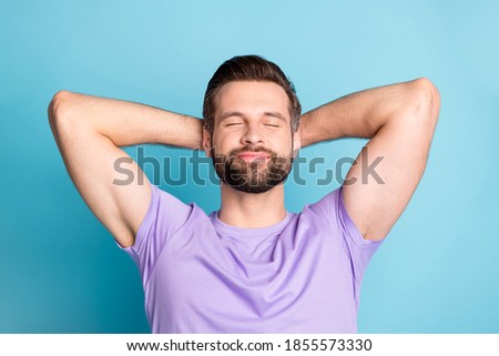 Top above high angle view photo of young attractive man enjoy free time rest relax hands behind head isolated over blue color background