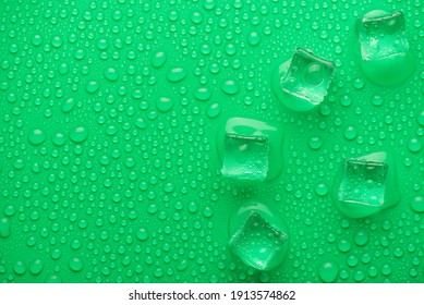 Top above overhead close up view photo of ice cubes on bright vibrant color backdrop with drops