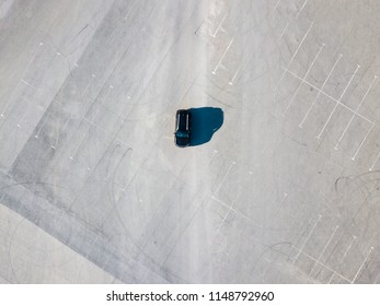 Top Above View Of Black Car Running On Blank Empty Asphalt Abstract Conept With Copy Space