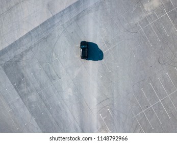 Top Above View Of Black Car Running On Blank Empty Asphalt Abstract Conept With Copy Space