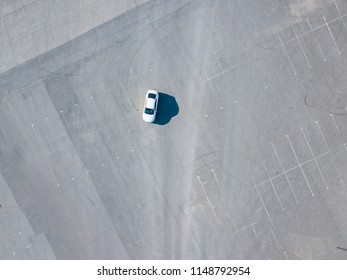 Top Aerial Abstract View Of Blue Car Running On Asphalt With Parking Lots Isolated Copy Space Design