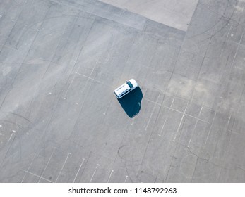 Top Aerial Abstract View Of Blue Car Running On Asphalt With Parking Lots Isolated Copy Space Design