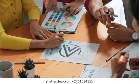 Top aerial view of business people working together to choosing color from color palette. Manager present idea by using tablet to marketing team while business man looking at logo graphic. Symposium. - Powered by Shutterstock