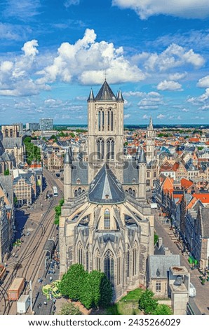 Top aerial view of Saint Nicholas Church Sint-Niklaaskerk Scheldt Gothic style building with tower in Ghent city historical centre Gent old town, East Flanders province, Flemish region, Belgium