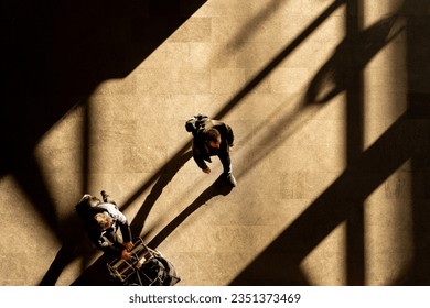 top aerial view tourist people walk across pedestrian concrete. a traveler walking with a suitcase at the airport. concept of social still life. - Powered by Shutterstock