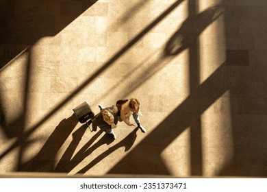 top aerial view tourist people walk across pedestrian concrete. a traveler walking with a suitcase at the airport. concept of social still life. - Powered by Shutterstock