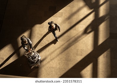 top aerial view tourist people walk across pedestrian concrete. a traveler walking with a suitcase at the airport. concept of social still life. - Powered by Shutterstock