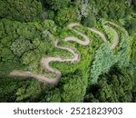 Top aerial view of a winding mountain footpath. Forest hairpin curvy hiking trail near Faial da Terra, Sao Miguel Island, Azores, Portugal