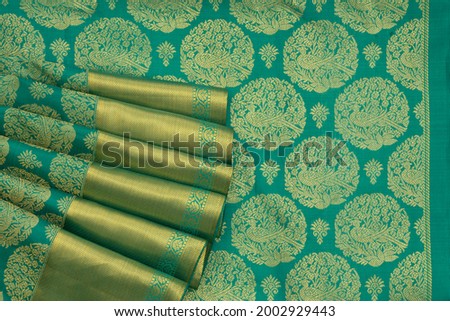 Top angle green saree with pallu 