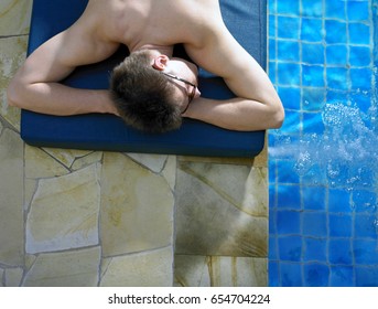 top angle of a man by the pool side