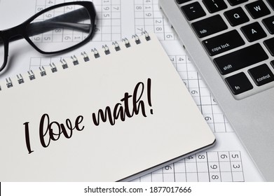 Top angle view of laptop, eyeglasses and notebook written with text I LOVE MATH!. Education concept.  - Powered by Shutterstock - Get 15% off with code: PIKWIZARD15