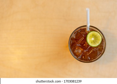 Top Angle View Of Lemon Iced Tea On Table With Copy Space