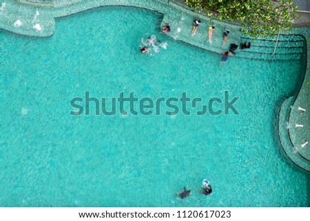 Top bird eye view of aqua blue swimming pool.