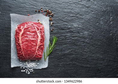The top blade steak or beef steak on the graphite board with herbs and spices. - Shutterstock ID 1349622986