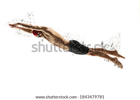 To top. Caucasian professional sportsman, swimmer training isolated on white studio background. Muscular, sportive man practicing in water sport. Concept of action, motion, youth, healthy lifestyle.