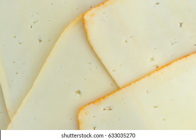 Top Close View Of Muenster Cheese Slices.